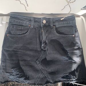 Black distressed denim skirt